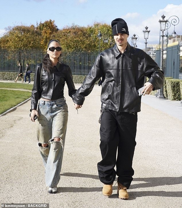 103325703-15228615-Romeo_Beckham_and_Kim_Turnbull_held_hands_during_a_day_out_in_Pa-m-21_1761490242460.jpg