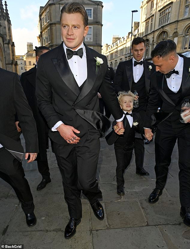 105044835-15415961-Adam_Peaty_has_arrived_at_his_wedding_hand_in_hand_with_his_ador-a-35_1766842896167.jpg