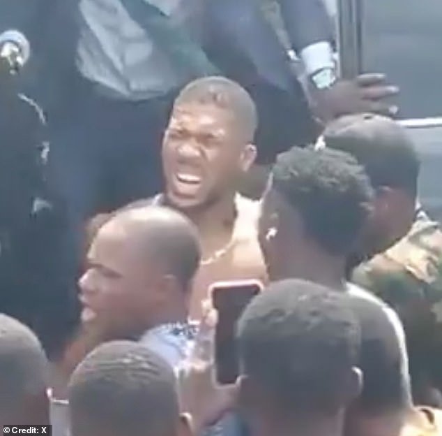 105081413-15419405-Anthony_Joshua_pictured_after_a_car_crash_in_Nigeria_on_Monday_w-a-3_1767022066441.jpg